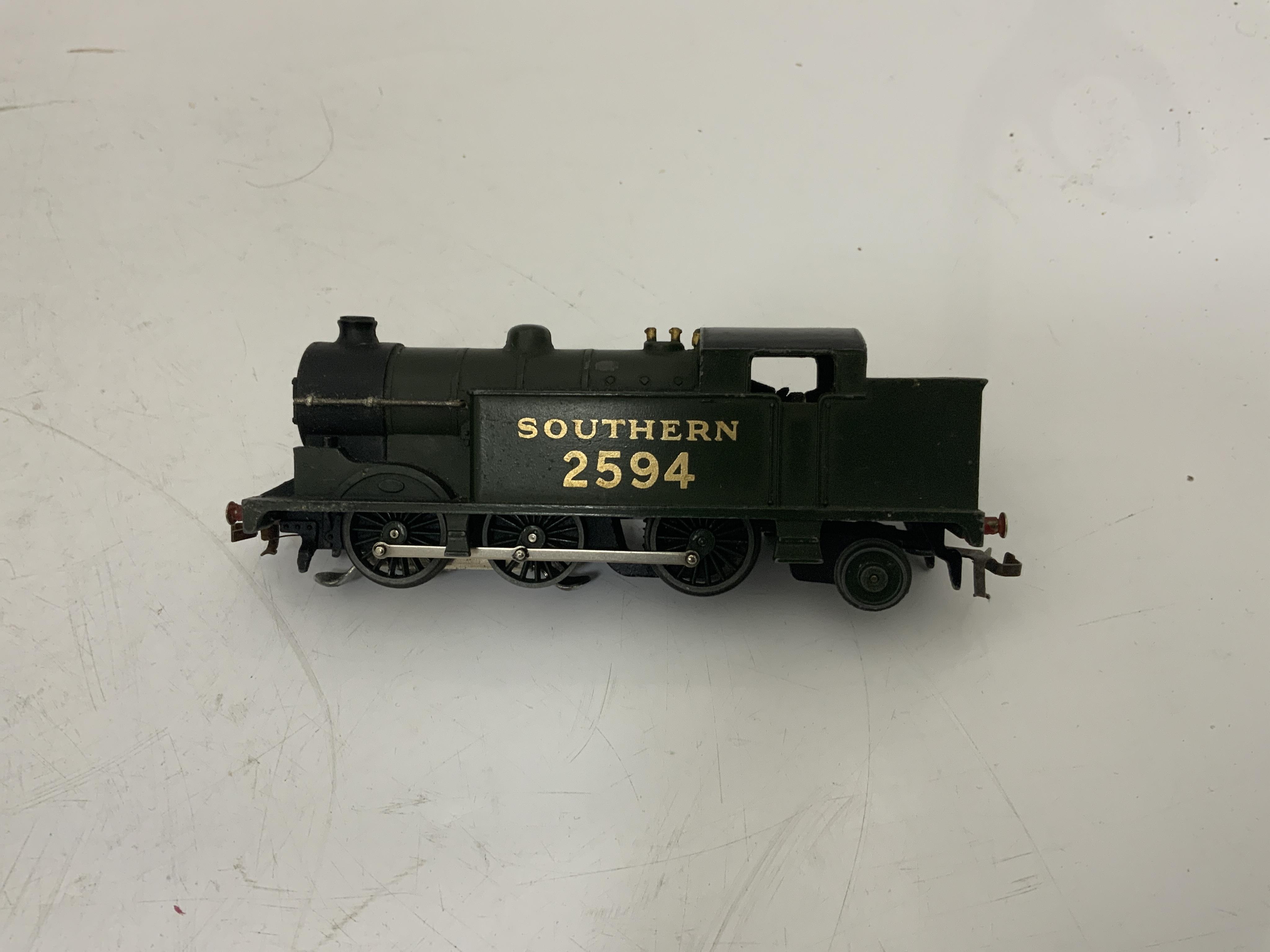 A boxed Hornby Dublo EDG7 Southern Railway Tank Goods Set, comprising of an SR Class N2 0-6-2T locomotive, 2594, for 3-rail running, two Southern freight wagons and an associated LMS open wagon, track sections, etc.
